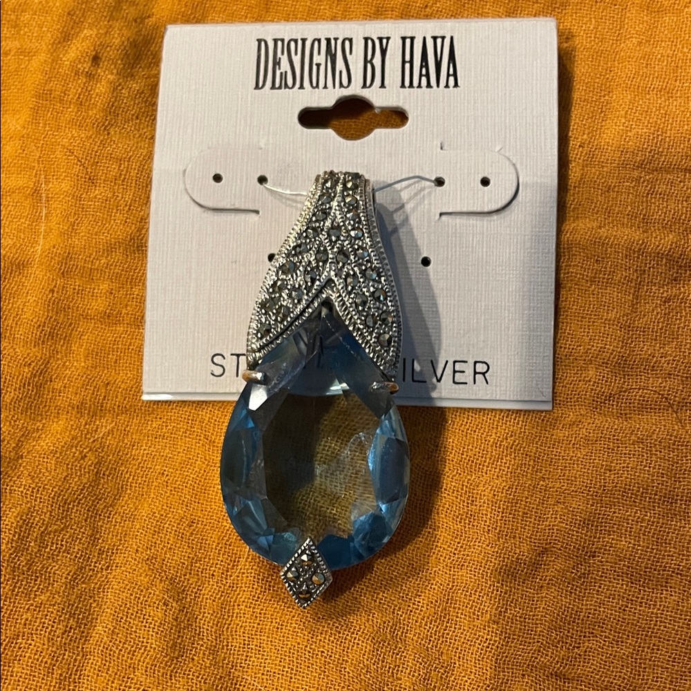 Sterling Silver and Blue topaz with marcasite pendant.OBO